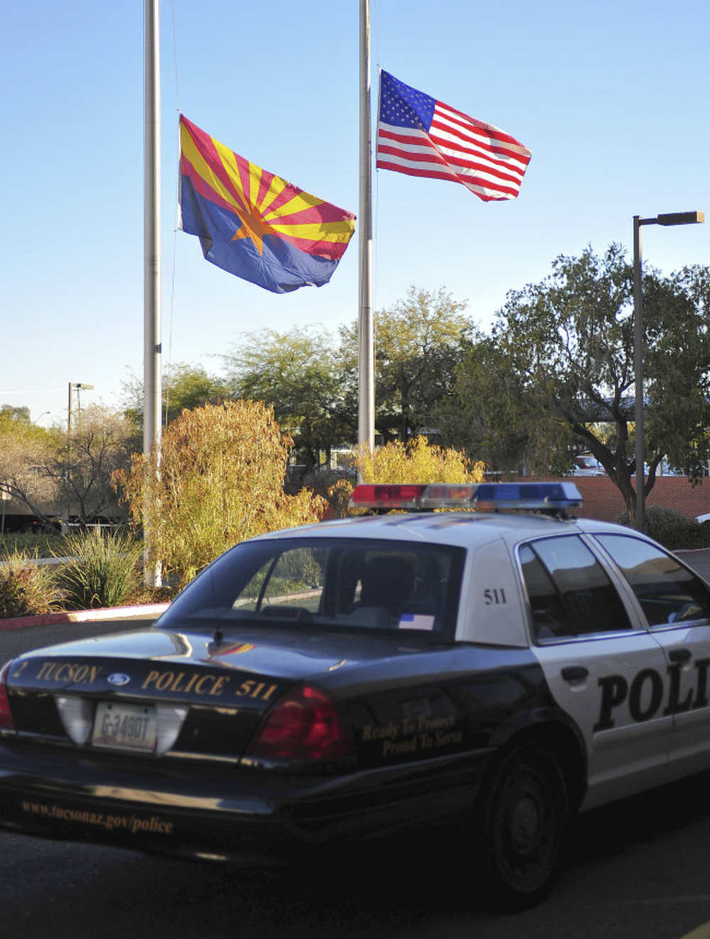 Flags fly at half-mast outside University Medical Center in Tucson where Rep. Gabrielle Giffords and other victims were being treated after being shot today.