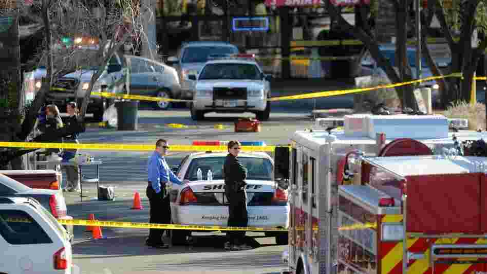 Police cordon off the shopping center where U.S. Rep. Gabrielle Giffords (D-AZ) and several others were shot during an event in front of a Tucson grocery store on Saturday. Police cordon off the shopping center where U.S. Rep. Gabrielle Giffords (D-AZ) and several others were shot during an event in front of a Tucson grocery store on Saturday.