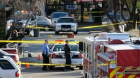Police cordon off the shopping center where U.S. Rep. Gabrielle Giffords (D-AZ) and several others were shot during an event in front of a Tucson grocery store on Saturday.