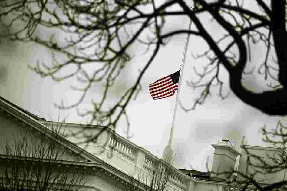 The flag on op top of the White House flies at half-staff Monday in honor of those killed and wounded in Tucson. 