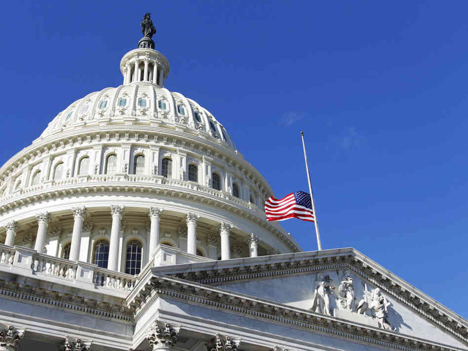 The American flag flies at half-mast on the U.S. Capitol in Washington Sunday, Jan. 9, 2011. The American flag flies at half-mast on the U.S. Capitol in Washington Sunday, Jan. 9, 2011.