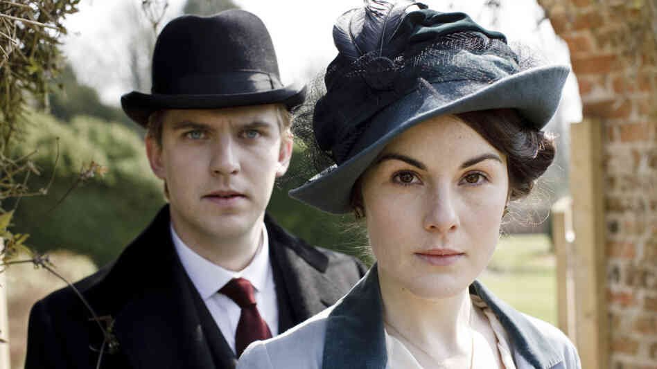 Dan Stevens (Matthew Crawley) and Michelle Dockery (Lady Mary Crawley) wear a variety of fabulous hats in Downton Abbey, which begins airing Sunday night on PBS's Masterpiece Classic. Dan Stevens (Matthew Crawley) and Michelle Dockery (Lady Mary Crawley) wear a variety of fabulous hats in Downton Abbey, which begins airing Sunday night on PBS's Masterpiece Classic.