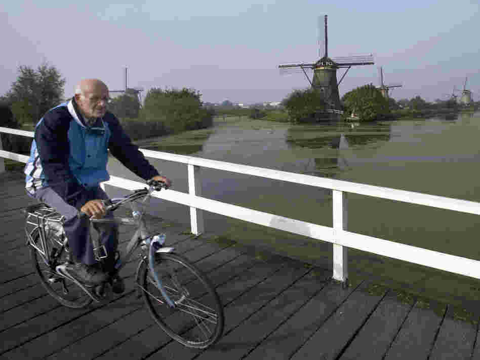 Dutch researchers have found that those with atypical parkinsonism were less likely to be able to ride a bike compared with patients with Parkinson's disease. A Dutch man who was not in the study rides his bike in front of windmills in Kinderdijk, the Netherlands in 2007.