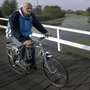 Dutch researchers have found that those with atypical parkinsonism were less likely to be able to ride a bike compared with patients with Parkinson's disease. A Dutch man who was not in the study rides his bike in front of windmills in Kinderdijk, the Netherlands in 2007.