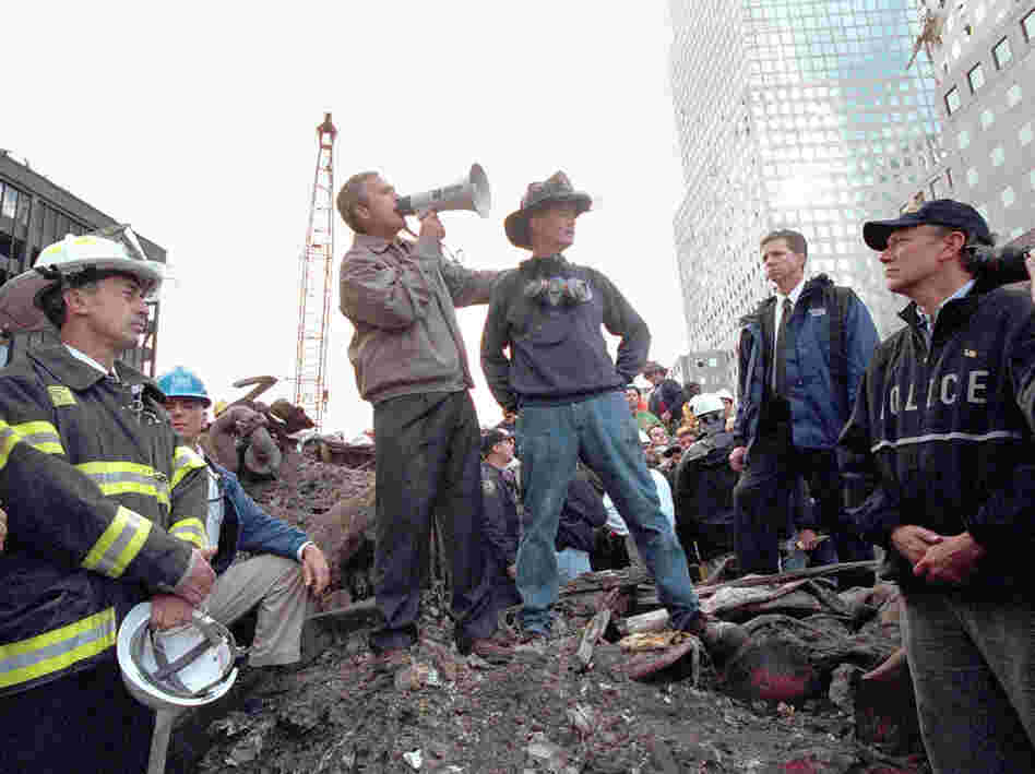 President George W. Bush speaks to rescue workers, firefighters and police officers from the rubble of ground zero on Sept. 14, 2001, in New York City.