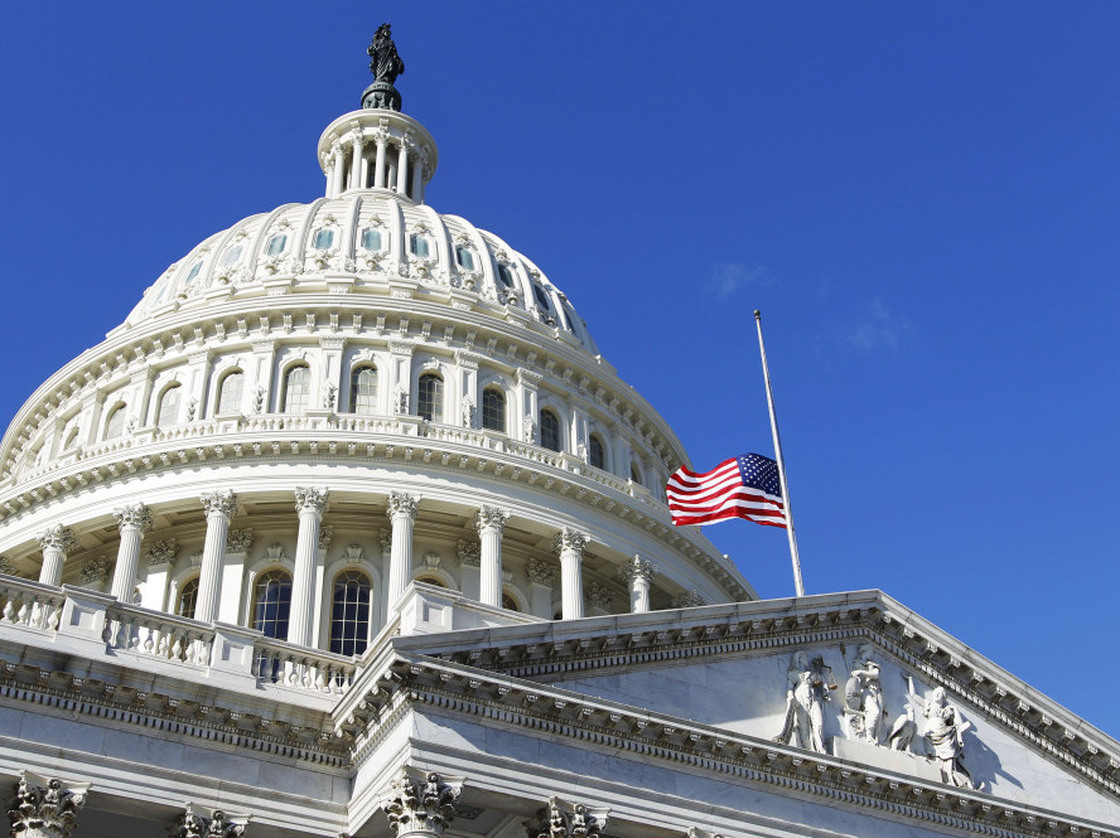 The American flag flies at half-staff on the U.S. Capitol in Washington Sunday, Jan. 9, 2011, to honor Gabe Zimmerman.