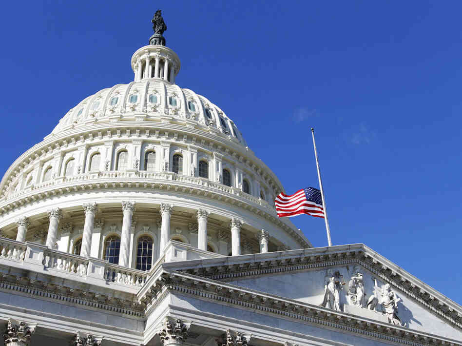 The American flag flies at half-staff on the U.S. Capitol in Washington Sunday, Jan. 9, 2011, to honor Gabe Zimmerman.