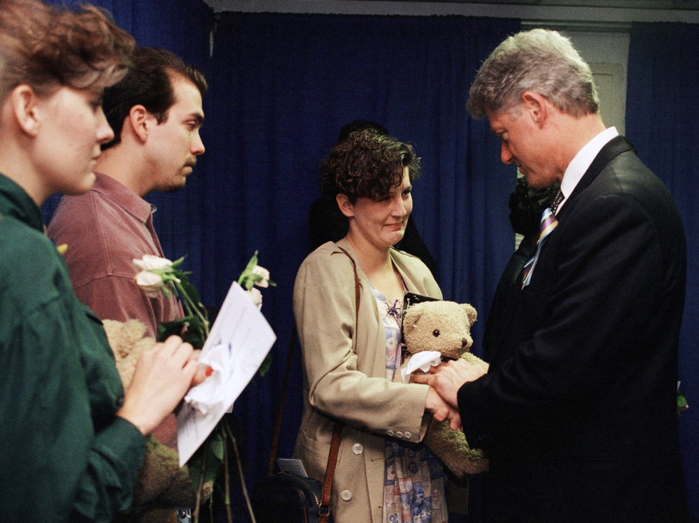 President Bill Clinton greets Aren Almon, whose 1-year old daughter, Baylee, was killed in the Oklahoma City bombing after a prayer service on April 23, 1995, for the victims of the attack.
