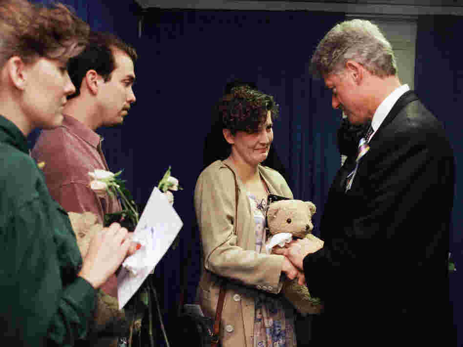 President Bill Clinton greets Aren Almon, whose 1-year old daughter, Baylee, was killed in the Oklahoma City bombing after a prayer service on April 23, 1995, for the victims of the attack.