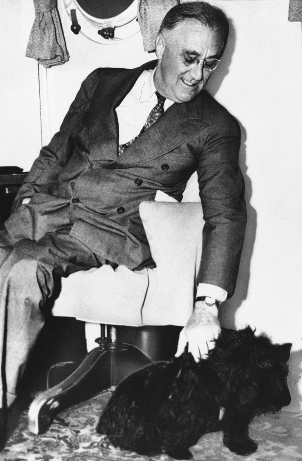 Shown in an undated photo of United States President Franklin D. Roosevelt with his pet dog Fala.