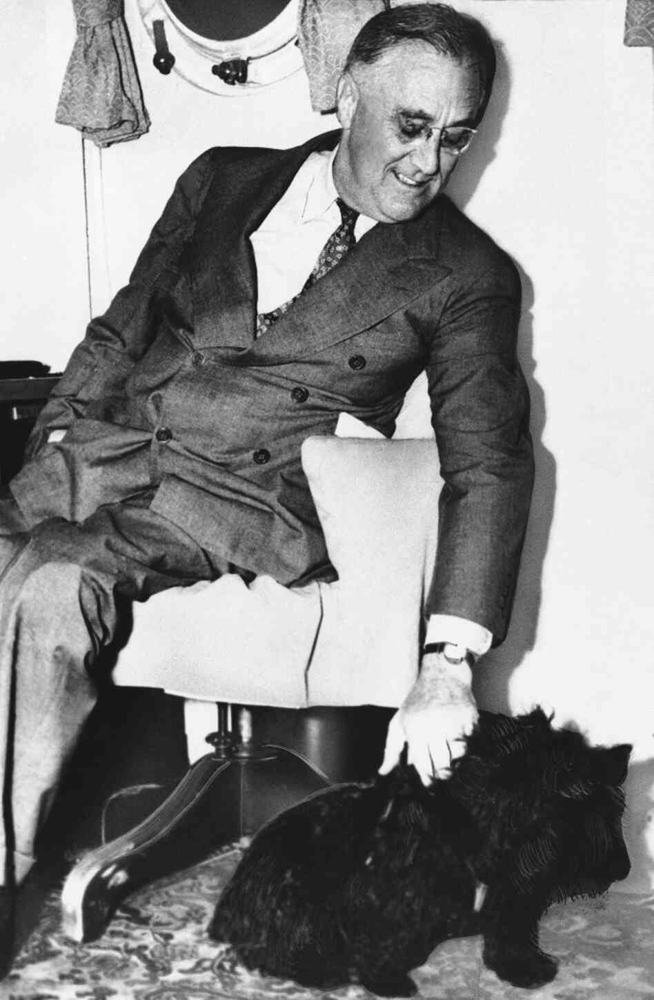 Shown in an undated photo of United States President Franklin D. Roosevelt with his pet dog Fala.
