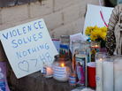 A makeshift memorial outside of the District Office of Rep. Gabrielle Giffords (D-AZ) on Sunday. The sign sends this message: "violence solves nothing; love is greater than hate." A makeshift memorial outside of the District Office of Rep. Gabrielle Giffords (D-AZ) on Sunday. The sign sends this message: "violence solves nothing; love is greater than hate."