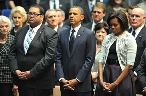 President Obama and First Lady Michelle Obama attend the tribute service in Tucson.