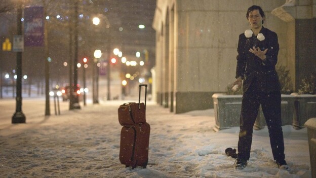Adrian Hagen of Florida stops to juggle snow balls while walking along Peachtree Street in Atlanta.