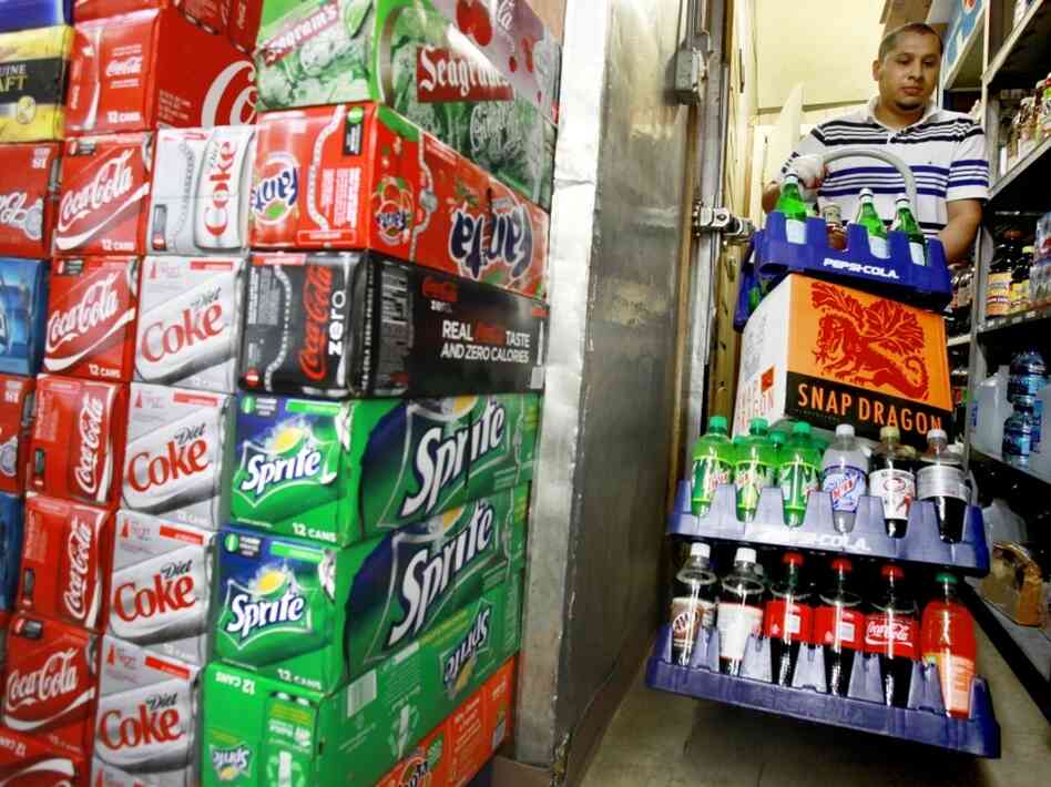 Antonio Garcia re-stocks the beverages at The Corner Market in Washington, D.C., in 2010.