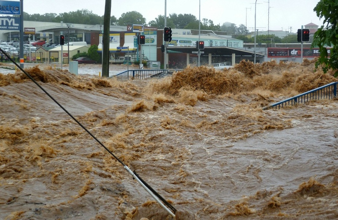 Water gushes into a shopping center in Toowoomba, Australia as the region braces for more deadly flooding.