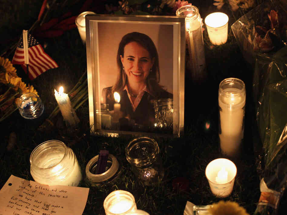 People place candles around a portrait of U.S. Rep. Gabrielle Giffords, who was shot Jan. 8 in Tucson, Ariz. Giffords was shot in the head at a public event, allegedly by Jared Loughner. People place candles around a portrait of U.S. Rep. Gabrielle Giffords, who was shot Jan. 8 in Tucson, Ariz. Giffords was shot in the head at a public event, allegedly by Jared Loughner.