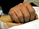 The hands of Mark Kelly and Rep. Gabrielle Giffords. The hands of Mark Kelly and Rep. Gabrielle Giffords.