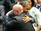 President Barack Obama hugs NASA astronaut Mark Kelly, husband of Rep. Gabrielle Giffords (D-AZ), during a memorial service in Tucson, Ariz., Wednesday. President Barack Obama hugs NASA astronaut Mark Kelly, husband of Rep. Gabrielle Giffords (D-AZ), during a memorial service in Tucson, Ariz., Wednesday.