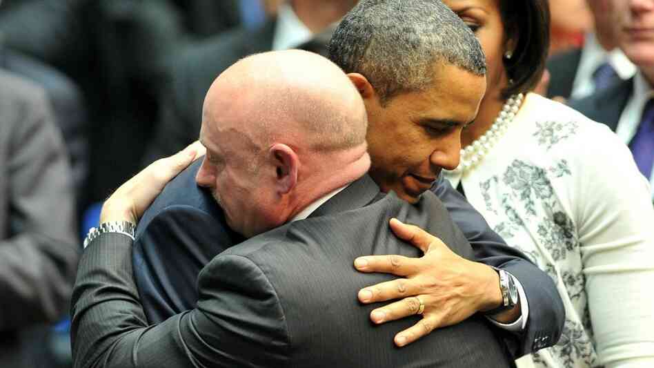 President Barack Obama hugs NASA astronaut Mark Kelly, husband of Rep. Gabrielle Giffords (D-AZ), during a memorial service in Tucson, Ariz., Wednesday. President Barack Obama hugs NASA astronaut Mark Kelly, husband of Rep. Gabrielle Giffords (D-AZ), during a memorial service in Tucson, Ariz., Wednesday.