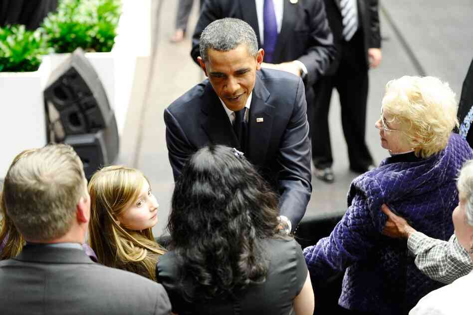 President Obama greets family members of shooting victims during the memorial event. 