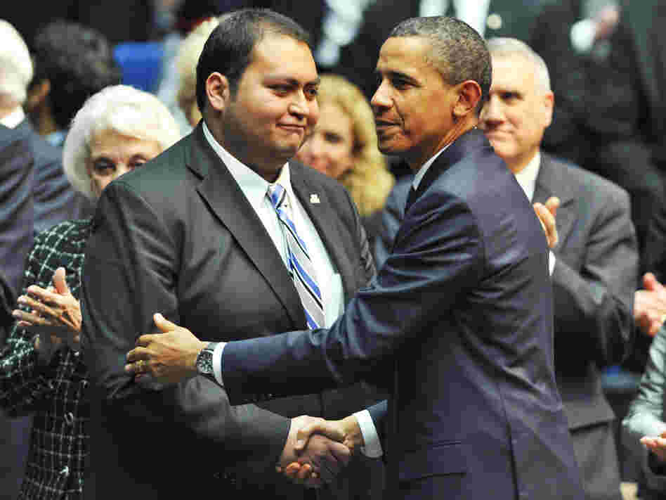 President Obama shakes hands with Daniel Hernandez Jr., during the memorial event, "Together We Thrive: Tucson and America," at the McKale Memorial Center in Tucson, Arizona, on Wednesday (Jan. 12, 2011).