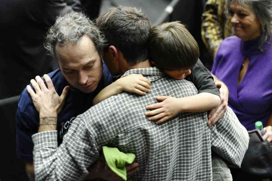 A group mourns during the service. 