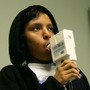 Nurse Maria Aguilar encourages teenager Jesus Ayala during a test of his lung capacity at a Los Angeles clinic in 2007.