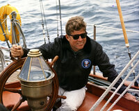 President Kennedy sails aboard the Manitou off the coast of Maine, Aug. 12, 1962.
