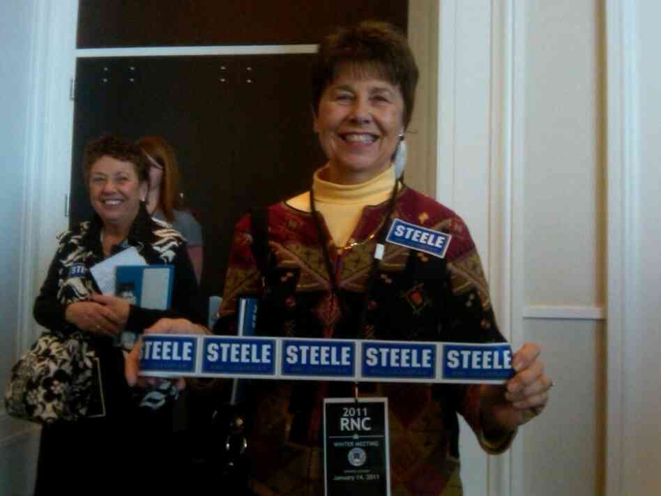 Woman with Michael Steele bumper stickers.