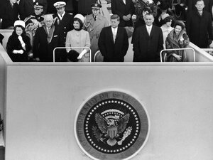 John F. Kennedy stands on a platform for his inauguration on the east front of the U.S. Capitol on Jan. 20, 1961, accompanied by his parents, Rose and Joseph Kennedy, First Lady Jacqueline Kennedy, Vice President Lyndon Baines Johnson and his wife, Lady Bird Johnson. 