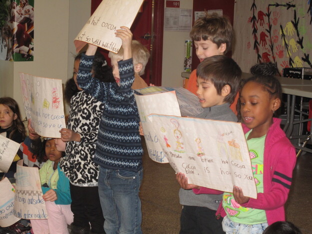 Pre-kindergarten through third grade students recite poems in English and Chinese. 