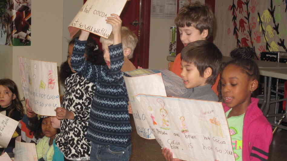 Pre-kindergarten through third grade students recite poems in English and Chinese. 