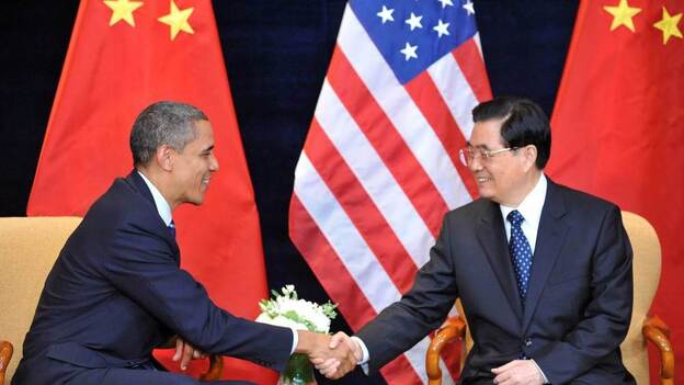 President Barack Obama shakes hands with Chinese President Hu Jintao before the G20 summit in Seoul last November.