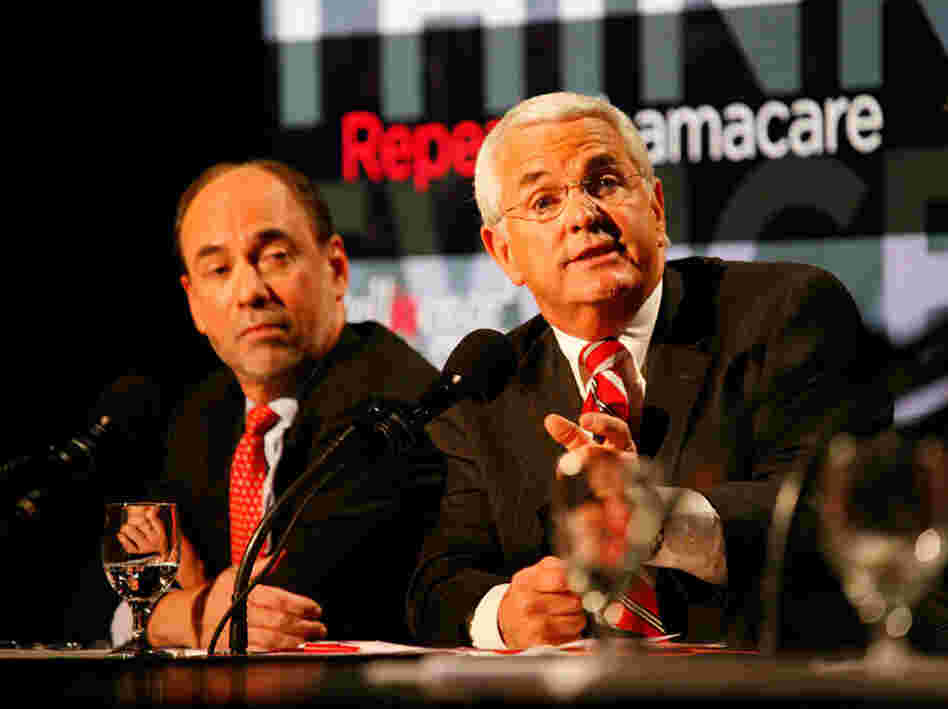 Douglas Holtz-Eakin (left) and John Shadegg debated in favor of repealing the new health care law.