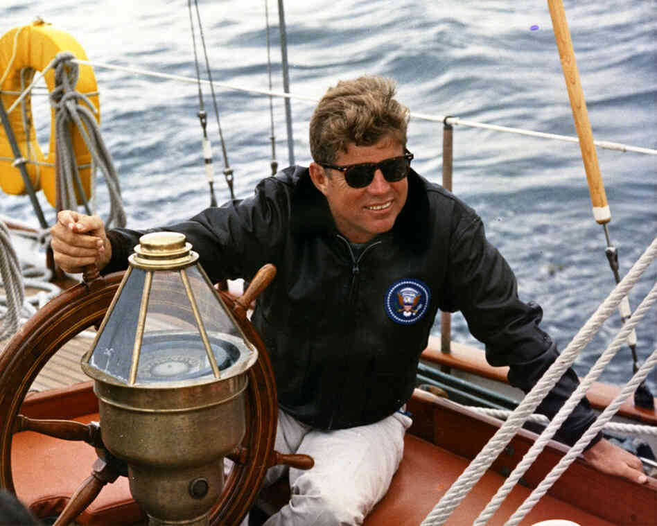 President Kennedy sails aboard the Manitou off the coast of Maine, Aug. 12, 1962. 