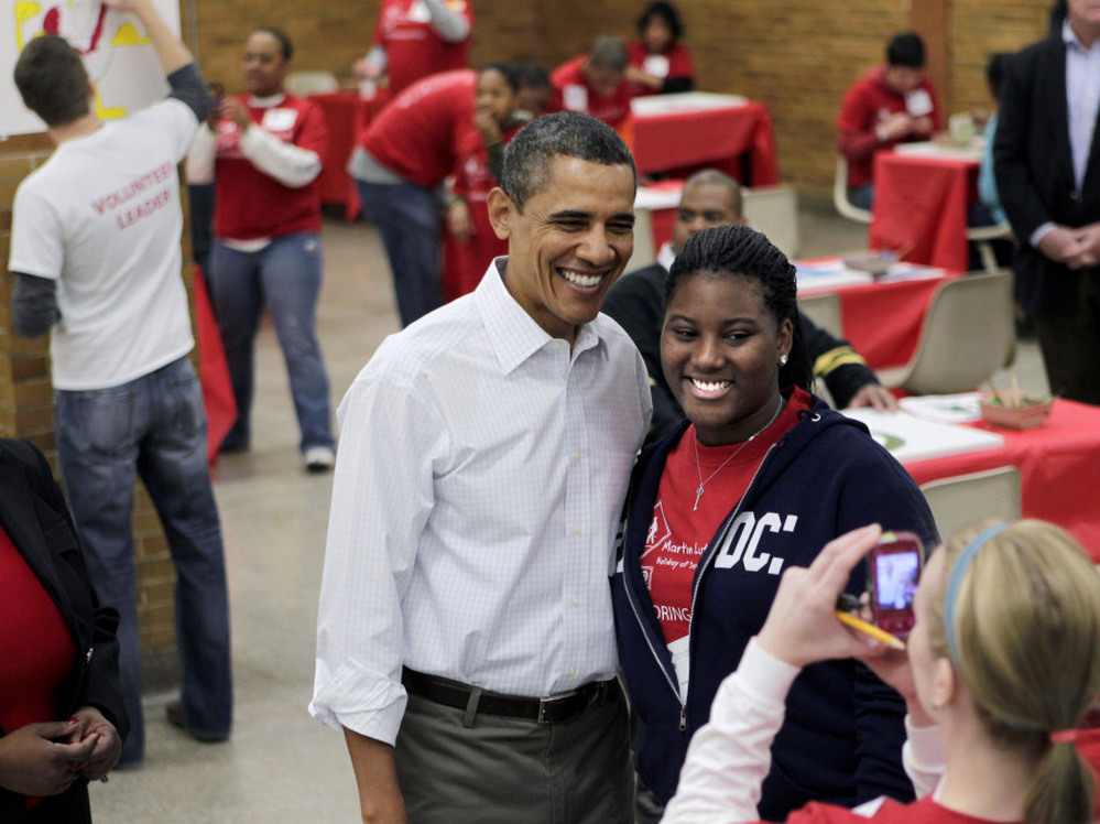 President Obama posed with a volunteer at a MLK Jr. holiday community service project in Washington, DC.