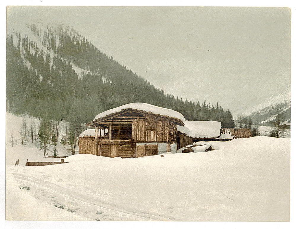 Winter scene with log structure.