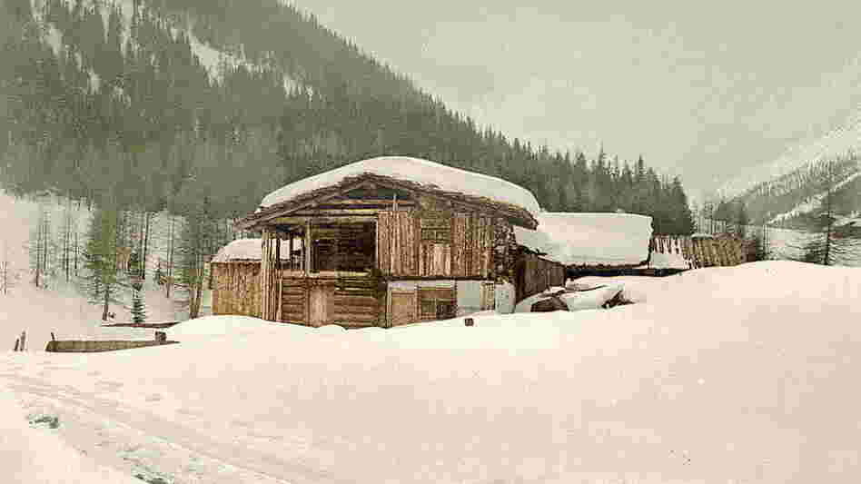 Winter scene with log structure.