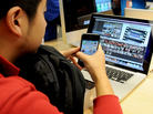 A Chinese customer checks out his newly purchased iPhone 4 at Apple's flagship store in Beijing. Mobile Internet use in China topped 300 million people in 2010. A Chinese customer checks out his newly purchased iPhone 4 at Apple's flagship store in Beijing. Mobile Internet use in China topped 300 million people in 2010.