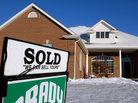 A "sold" sign in the front yard of a home in Springfield, Ill., last month. A "sold" sign in the front yard of a home in Springfield, Ill., last month.