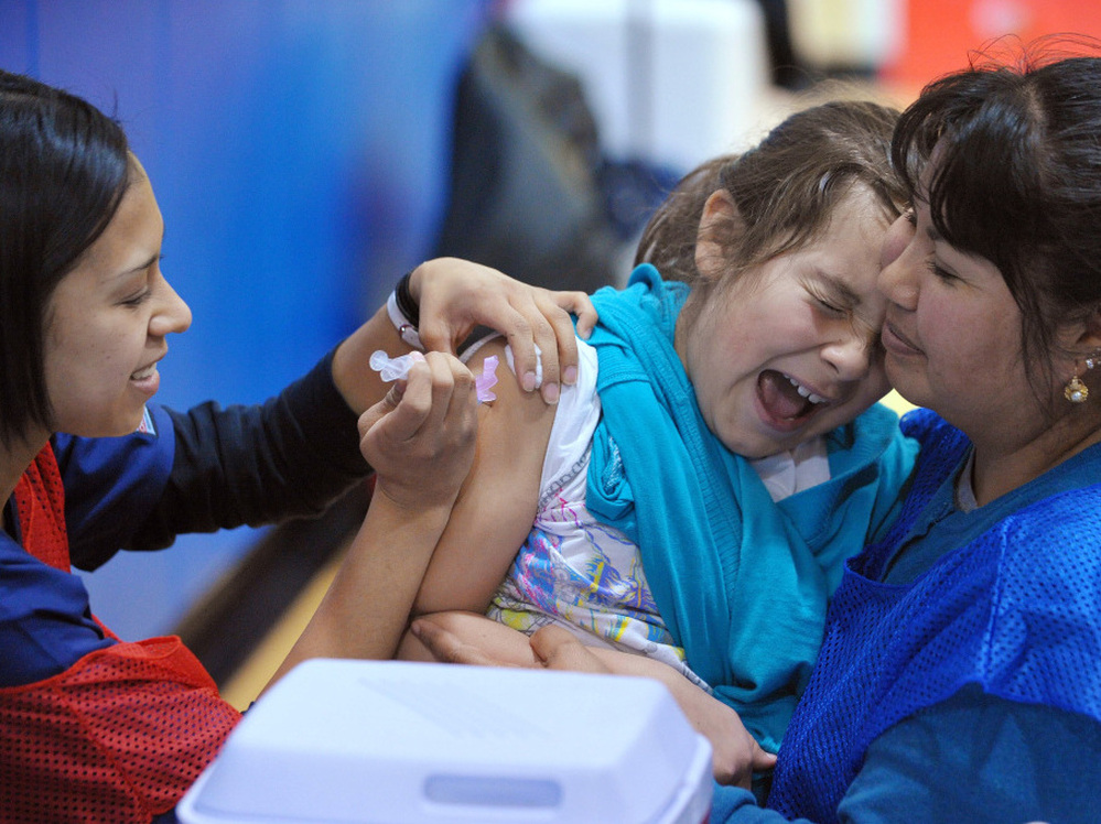 A student at Carlin Springs Elementary School receives a flu shot last January in Arlington, Va.