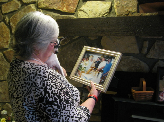 Judy Jones Petersen, with a treasured photo of her family. (NPR)