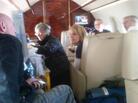 Gloria Giffords (center), Rep. Gabrielle Gifford's mother, talks with her daughter on the flight to Houston. Capt. Mark Kelly (far left), the representative's husband, talks with Tracy Culbert (center right), a nurse. Gloria Giffords (center), Rep. Gabrielle Gifford's mother, talks with her daughter on the flight to Houston. Capt. Mark Kelly (far left), the representative's husband, talks with Tracy Culbert (center right), a nurse.
