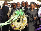Haitian President Rene Preval (center) prepares to lay a wreath on Jan. 11 at St. Christophe in Port-au-Prince, where thousands of victims of the Jan. 12, 2010, earthquake are buried. Haitian President Rene Preval (center) prepares to lay a wreath on Jan. 11 at St. Christophe in Port-au-Prince, where thousands of victims of the Jan. 12, 2010, earthquake are buried.