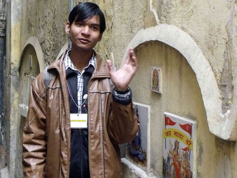 Satender Sharma, 18, is a former street kid who now, as a tour guide for the Salaam Baalak Trust, leads visitors through the narrow alleys where he grew up in New Delhi. Satender Sharma, 18, is a former street kid who now, as a tour guide for the Salaam Baalak Trust, leads visitors through the narrow alleys where he grew up in New Delhi.