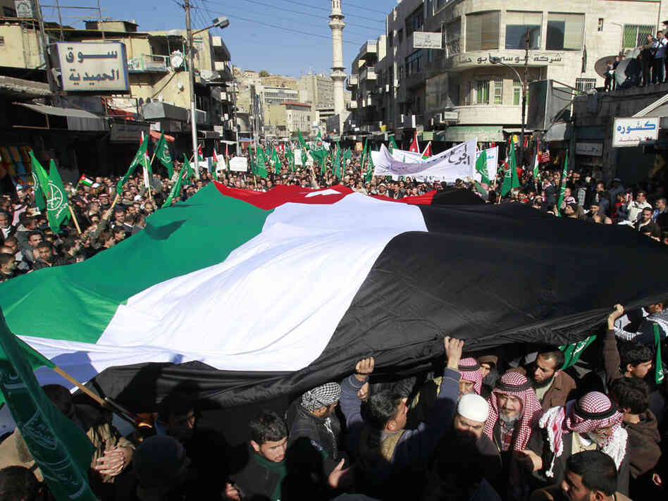 Thousands of Jordanian demonstrators attend a protest Friday against the country's economic policies, demanding "bread and freedom" and that the government resign. Thousands of Jordanian demonstrators attend a protest Friday against the country's economic policies, demanding "bread and freedom" and that the government resign.