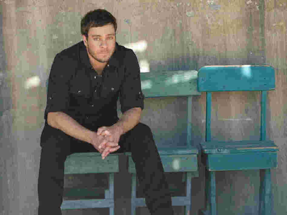On "Mission Bell," Amos Lee keeps coming back to the idea that moving on means leaving things behind. On "Mission Bell," Amos Lee keeps coming back to the idea that moving on means leaving things behind.