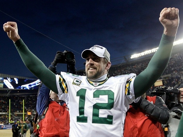 Quarterback Aaron Rodgers of the Green Bay Packers celebrates Sunday after his team's 21-14 victory against the Chicago Bears in the NFC Championship Game at Soldier Field  in Chicago, Illinois.