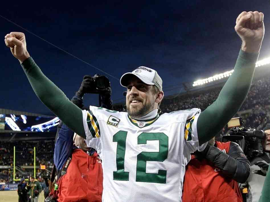 Quarterback Aaron Rodgers of the Green Bay Packers celebrates Sunday after his team's 21-14 victory against the Chicago Bears in the NFC Championship Game at Soldier Field  in Chicago, Illinois.